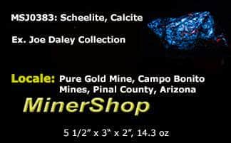 Large piece of red fluorescent calcite and bright blue scheelite from Arizona.