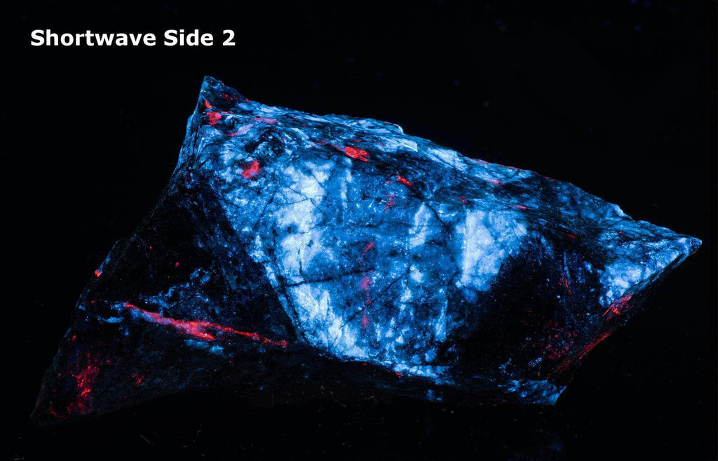 Large piece of red fluorescent calcite and bright blue scheelite from Arizona.