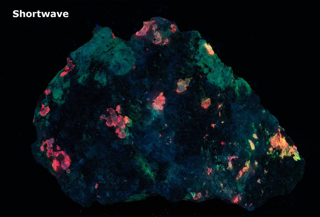 a fluorescent mineral specimen of tugtupite, chkalovite under shortwave UV light