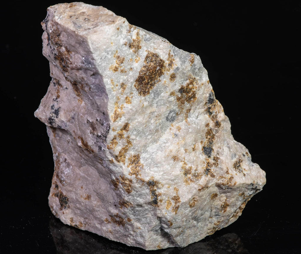 A rare Franklin assemblage of margarosanite, prehnite, axinite (red), willemite and pectolite.