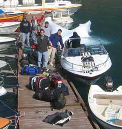 A group of people arriving at the dock after a boat ride
