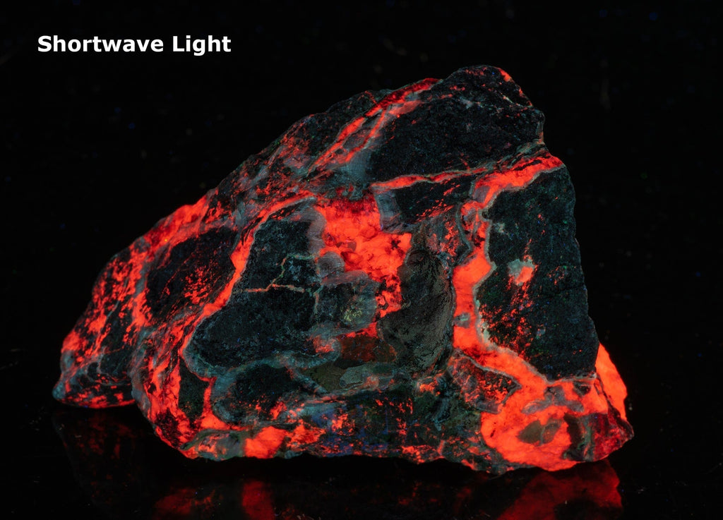 A very phosphorescent piece of calcite and willemite fluorescent under UV light