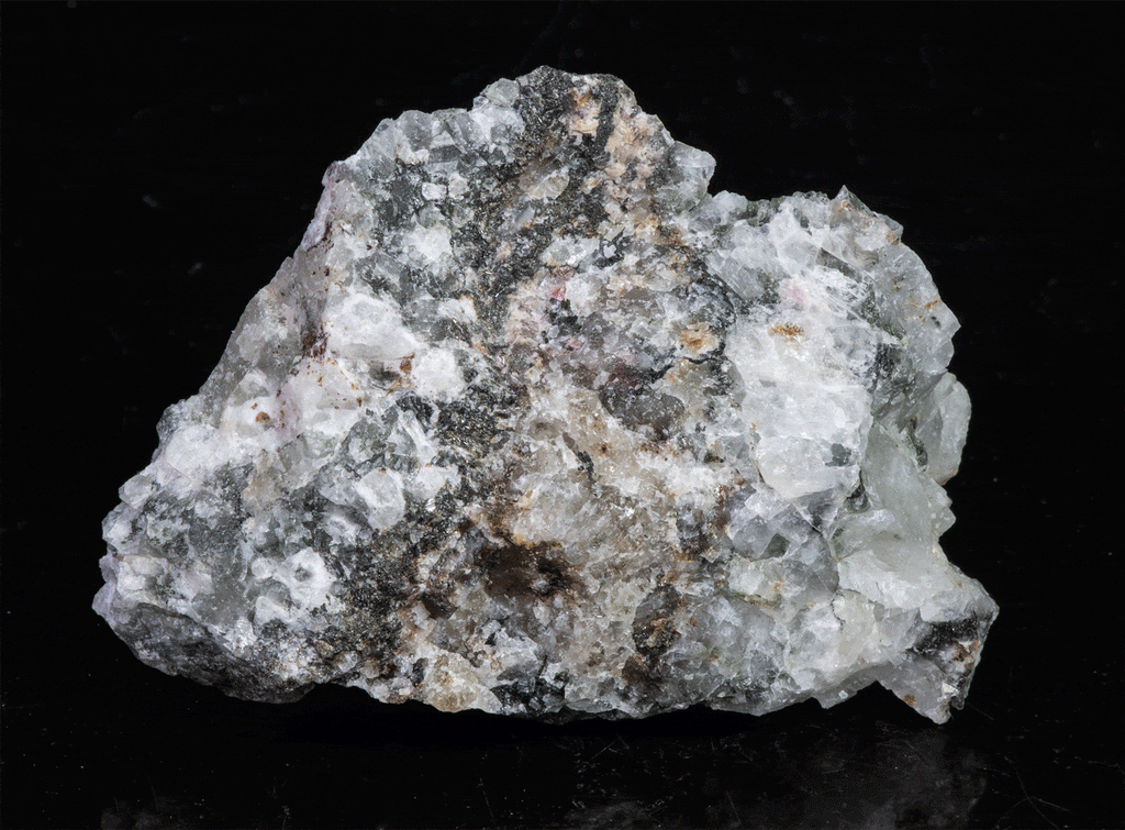 A miniature piece of fantasy rock containing tugtupite, sodalite and other rare minerals from Greenland