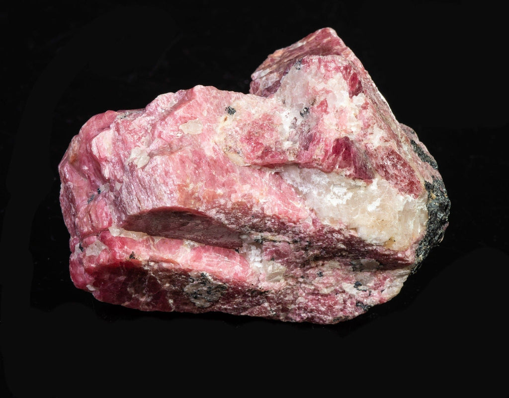 A Pink Rhodonite Crystal with Fluorescing Calcite from Franklin Mine