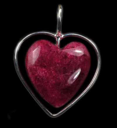 A piece of Tugtupite heart jewelry