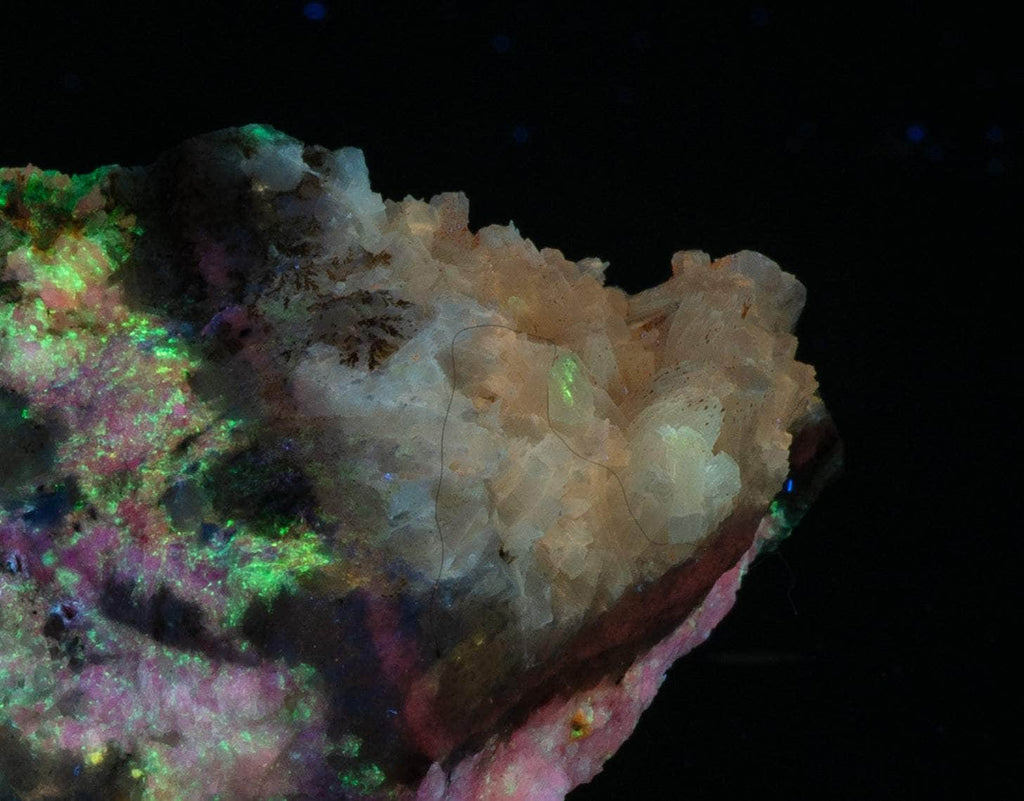 A smaller piece of our larger Kangerlussaq tugtupite specimens containing small tugtupite crystals dispersed throughout the matrix. 