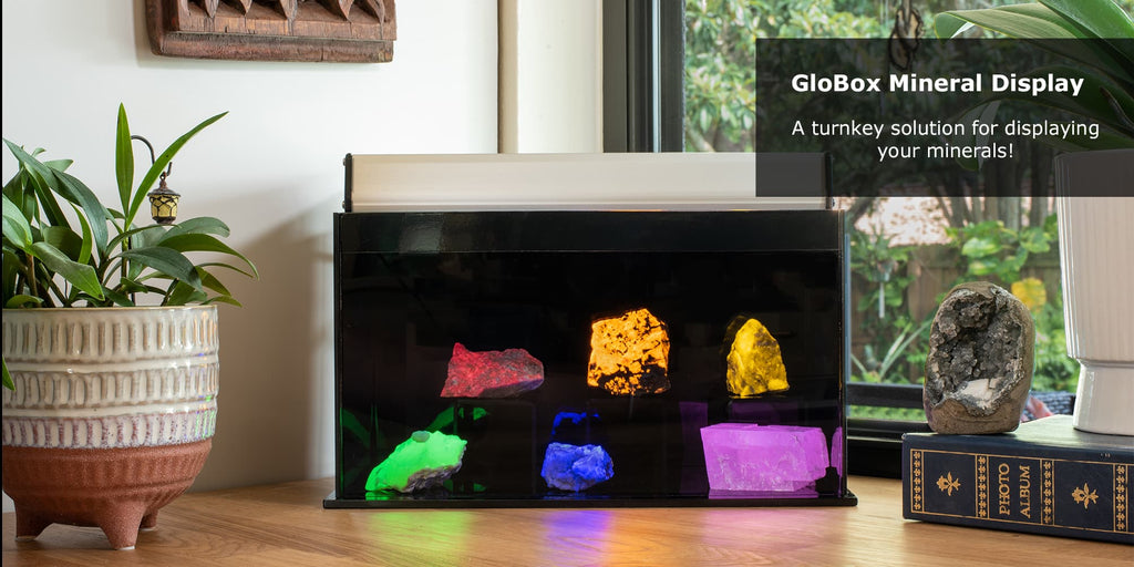 A fluorescent mineral display sitting on a kitchen countertop