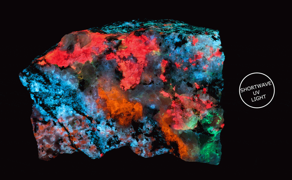 A fantasy rock mineral specimen shown under UV light