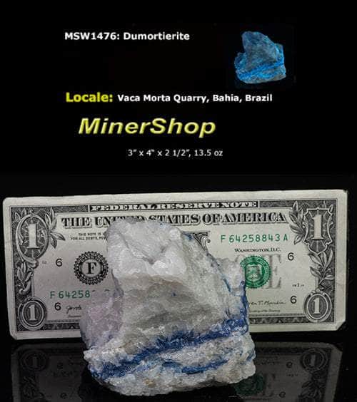 Blue dumortierite on top of a matrix of white quartz.