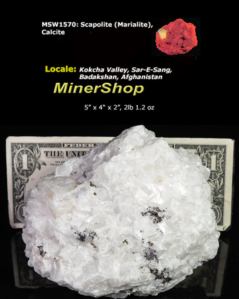 A huge specimen with a very nice, well-formed marialite (scapolite) crystal, fluorescent a bright yellow under longwave UV, on a calcite matrix