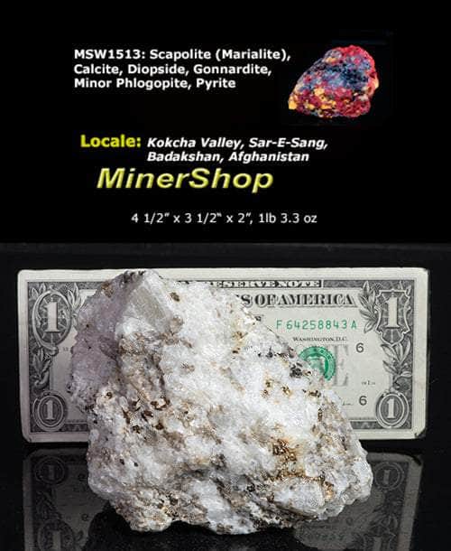 A nice specimen with Marialite (scapolite) crystals, fluorescent a bright yellow longwave, on a calcite matrix.