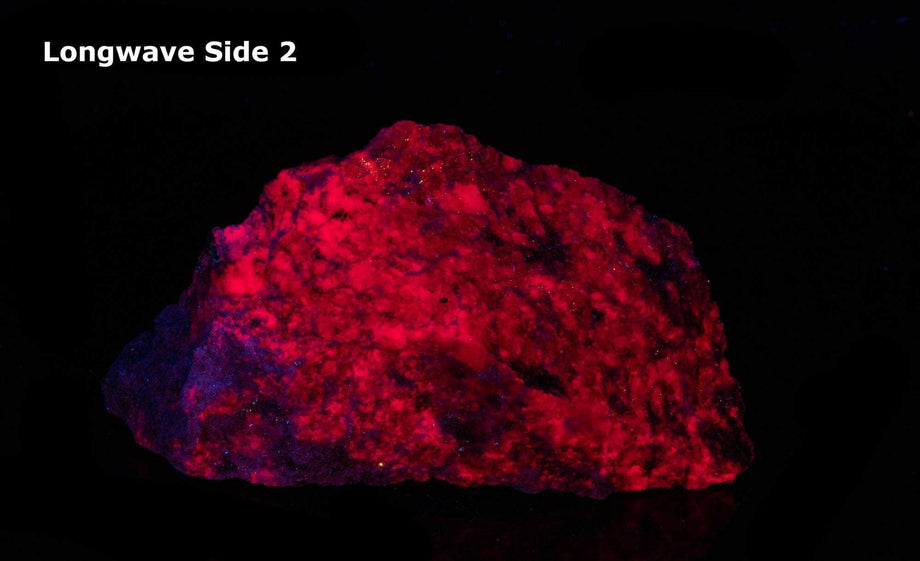 Bright red fluorescent ruby. Varigated, dark pinkish-red with