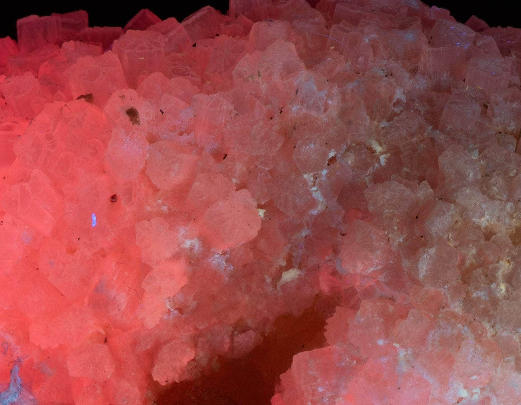 Yellow sulphur crystals sit atop an aragonite matrix