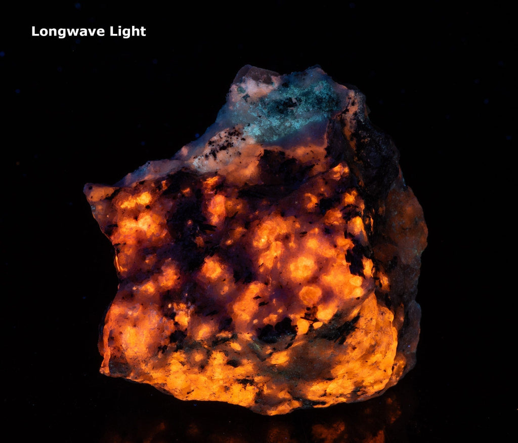 A nice piece of tenebrescent fantasy rock with broad areas of blue fluorescing analcime and exquisite tugtupite veining.  Areas of orange are fluorescent sodalite.