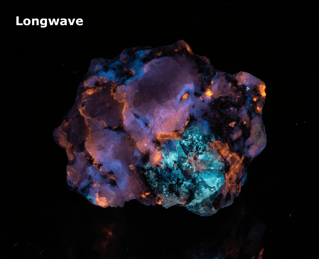 A piece of our highly sought after "Fantasy Rock". This piece features rich tugtupite that fluoresces a deep cherry red under shortwave UV.