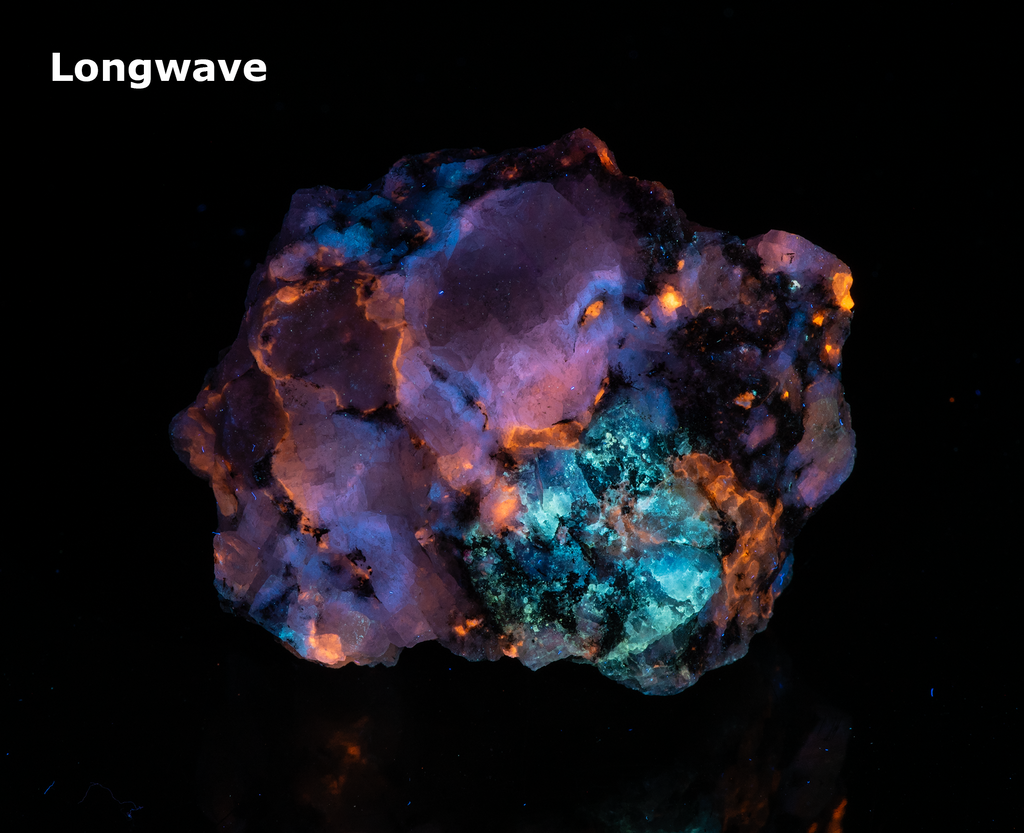 A piece of our highly sought after "Fantasy Rock". This piece features rich tugtupite that fluoresces a deep cherry red under shortwave UV.