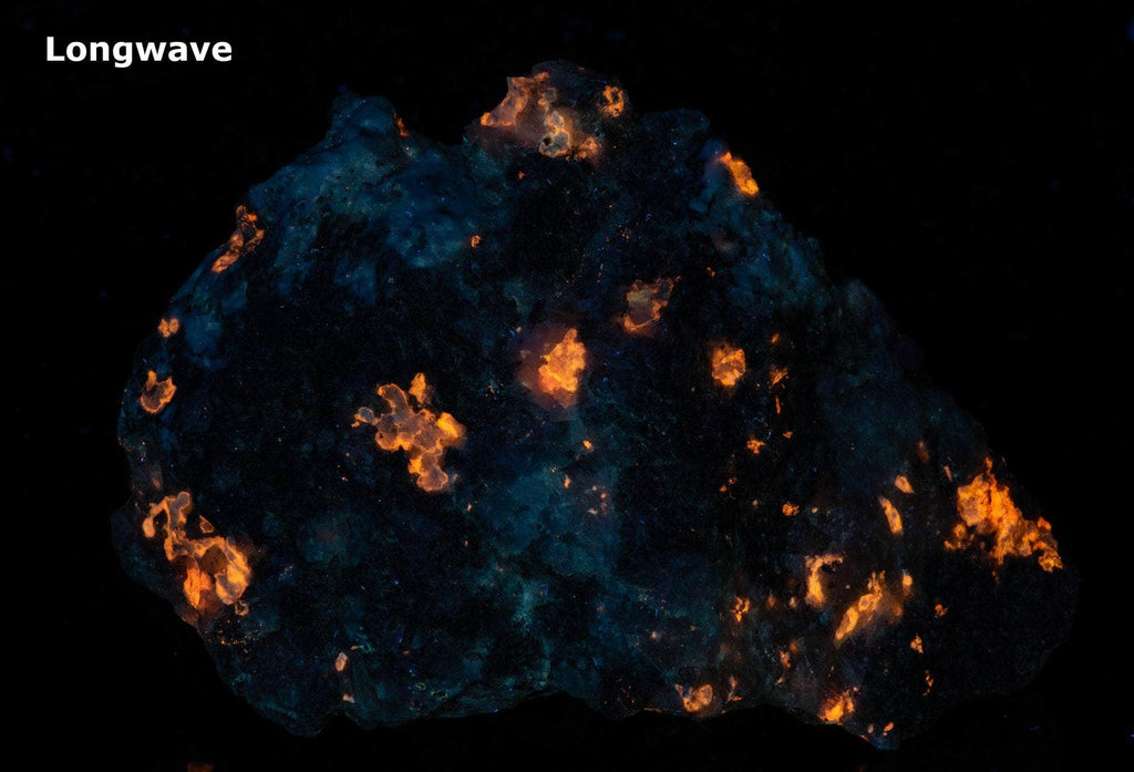 a fluorescent mineral specimen of tugtupite, chkalovite under longwave UV light