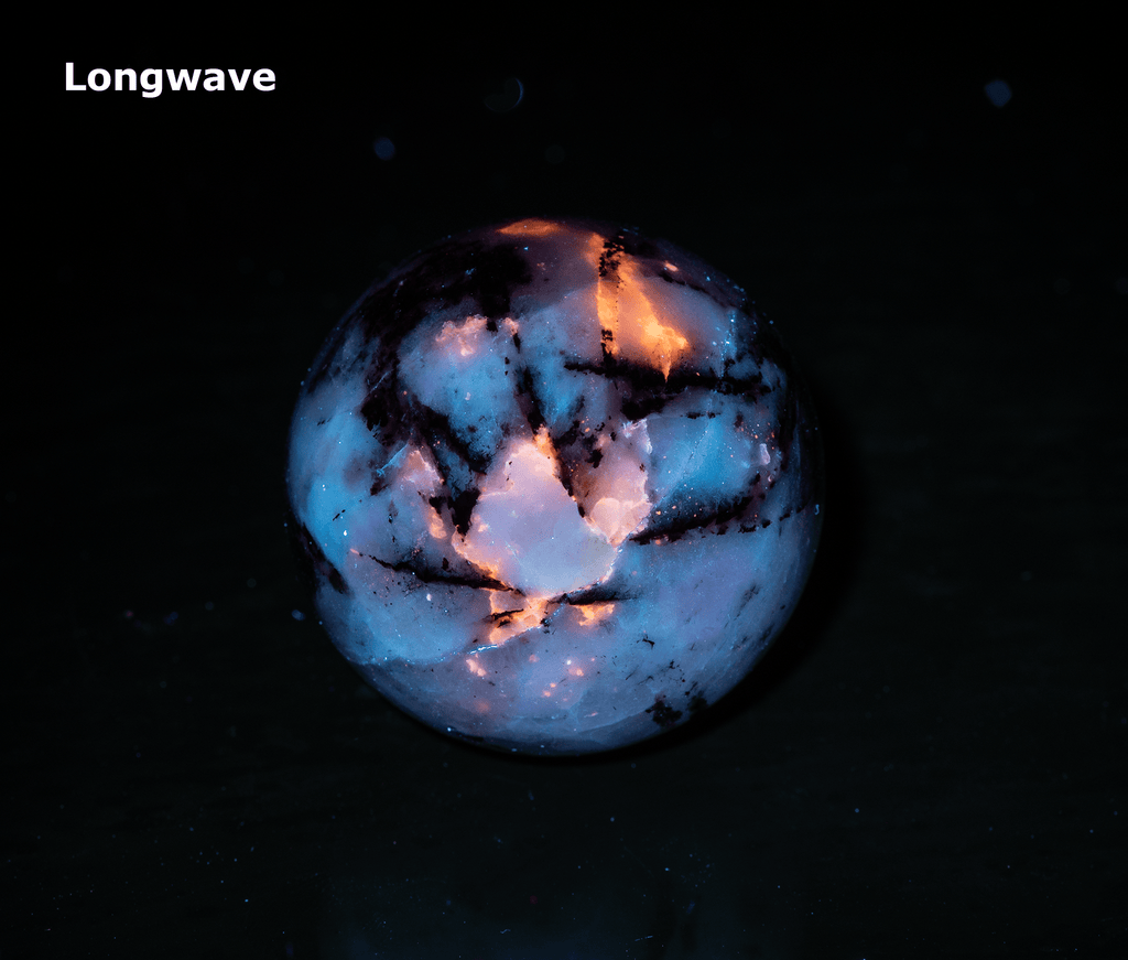 tugtupite and silver polylithionite sphere from Greenland