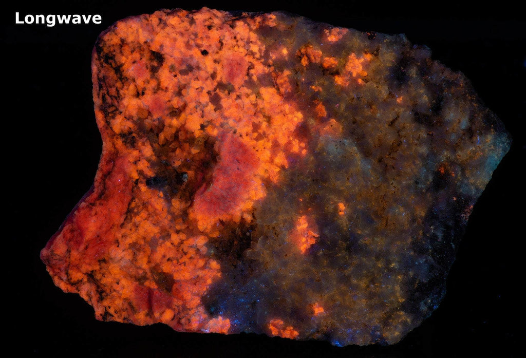 An incredible, unusual gemmy and extremely tenebrescent tugtupite specimen from Kangerlussaq. Vugs with large and well-formed, gemmy tugtupite crystals 