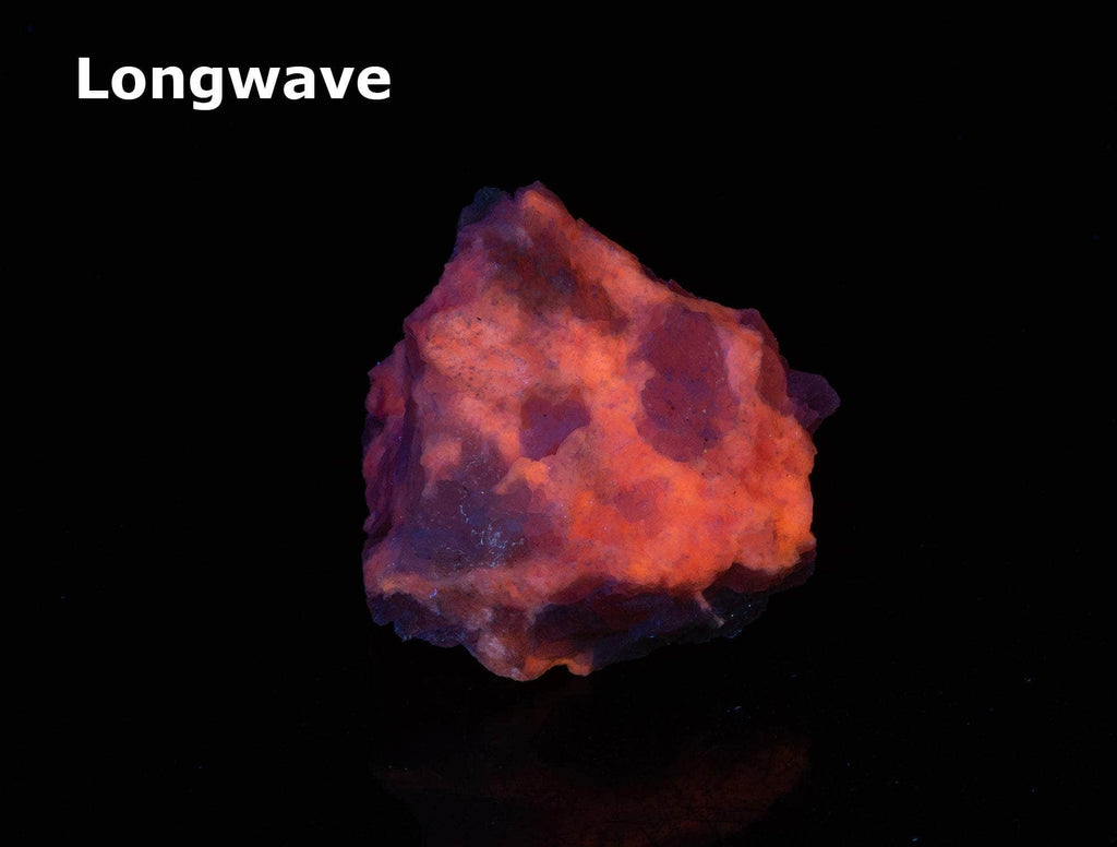 A classic piece of bright red fluorescent tugtupite 