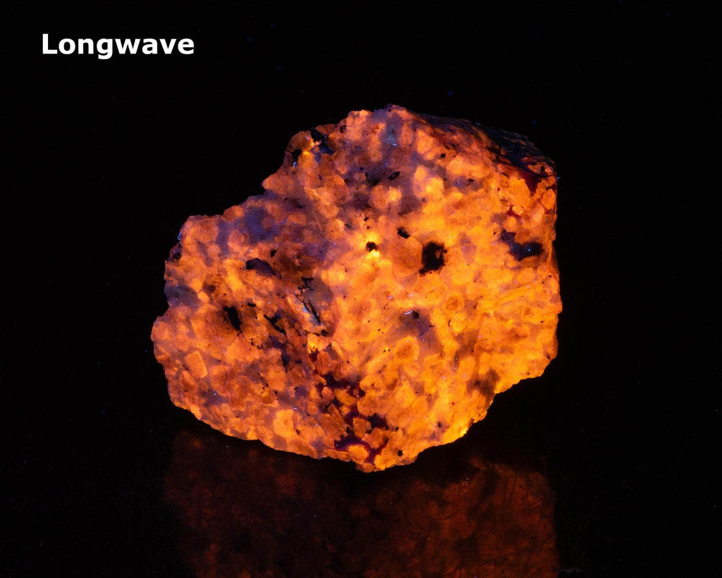 A deeply tenebrescent hackmanite sodalite specimen with minor tugtupite