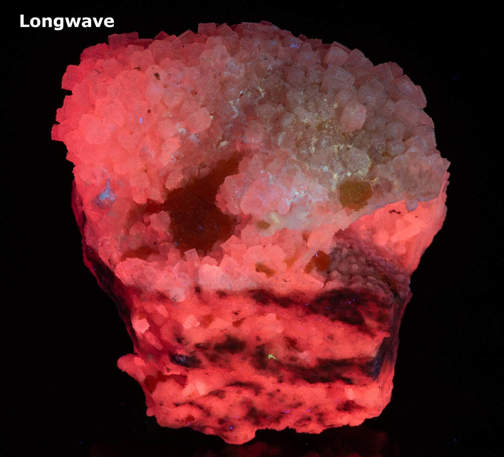 Yellow sulphur crystals sit atop an aragonite matrix