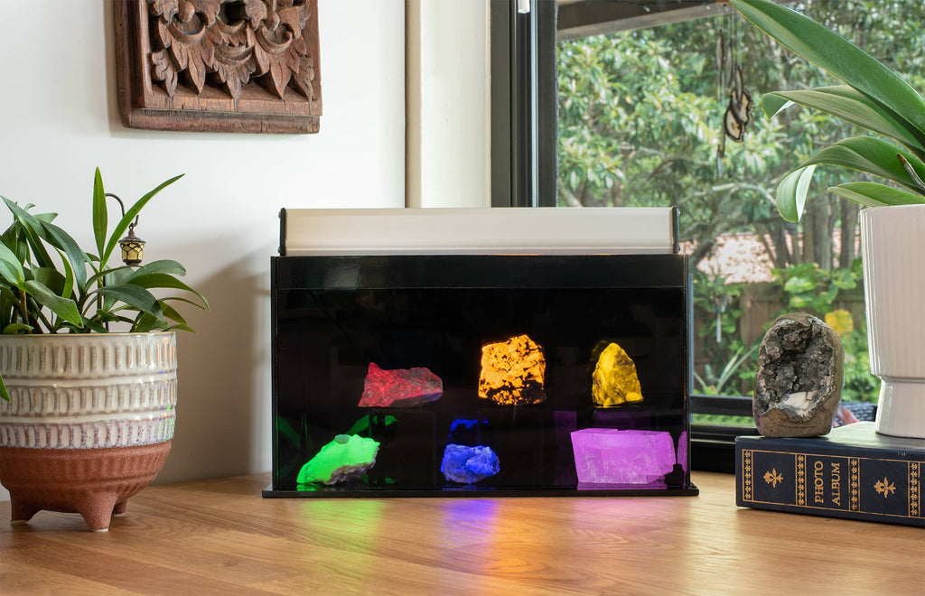 A fluorescent mineral display on top of a counter