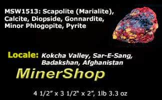 A nice specimen with Marialite (scapolite) crystals, fluorescent a bright yellow longwave, on a calcite matrix.