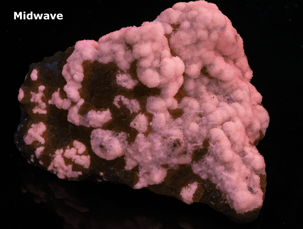 Yellow sulphur crystals sit atop an aragonite matrix