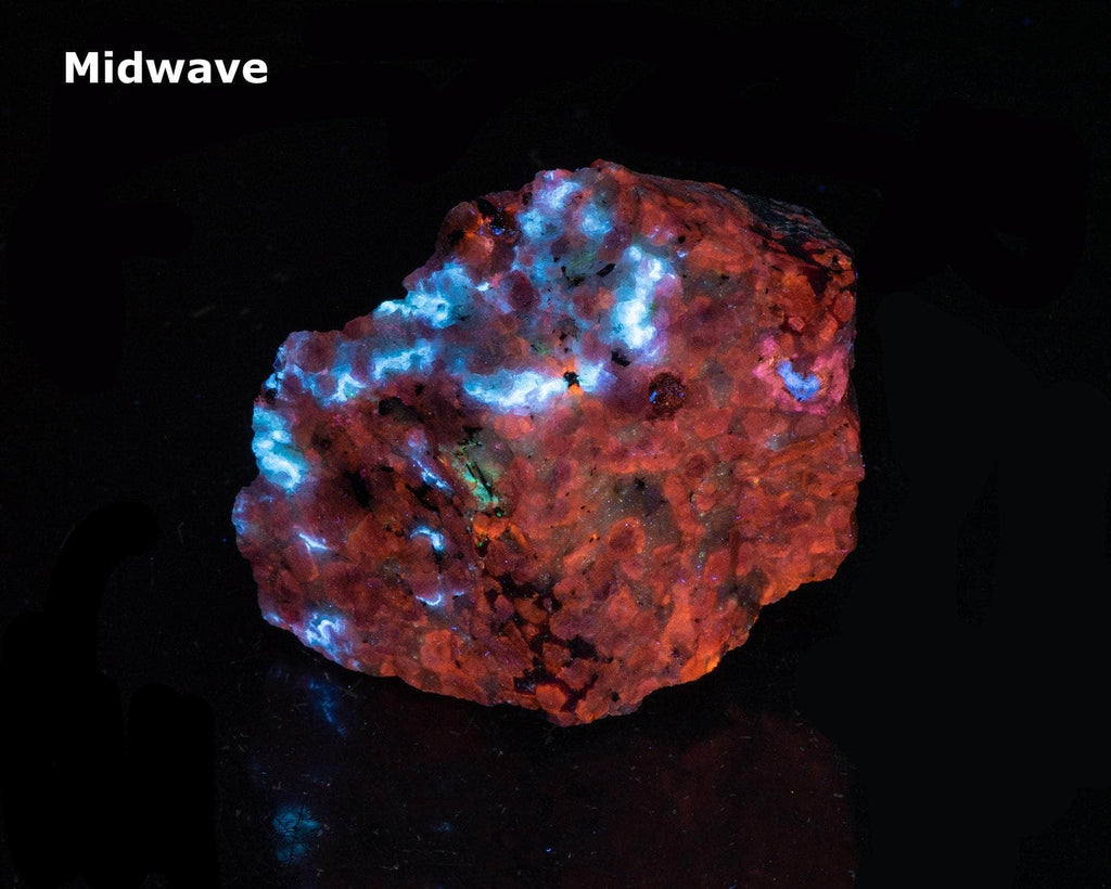 A deeply tenebrescent hackmanite sodalite specimen with minor tugtupite