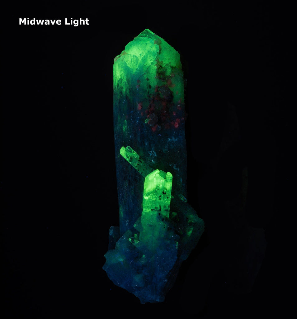 A danburite crystal fluorescent a bright green under midwave and shortwave UV light