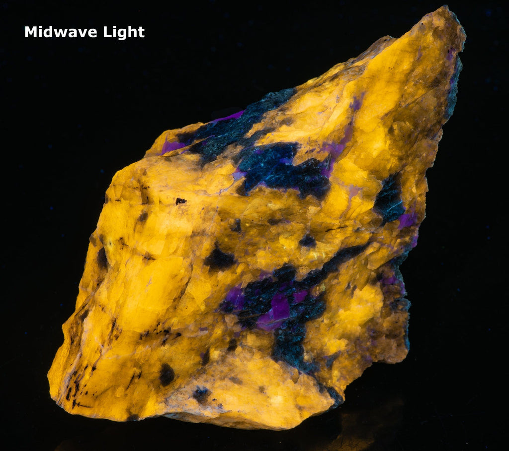 A fluorescent mineral rock of yellow wernerite