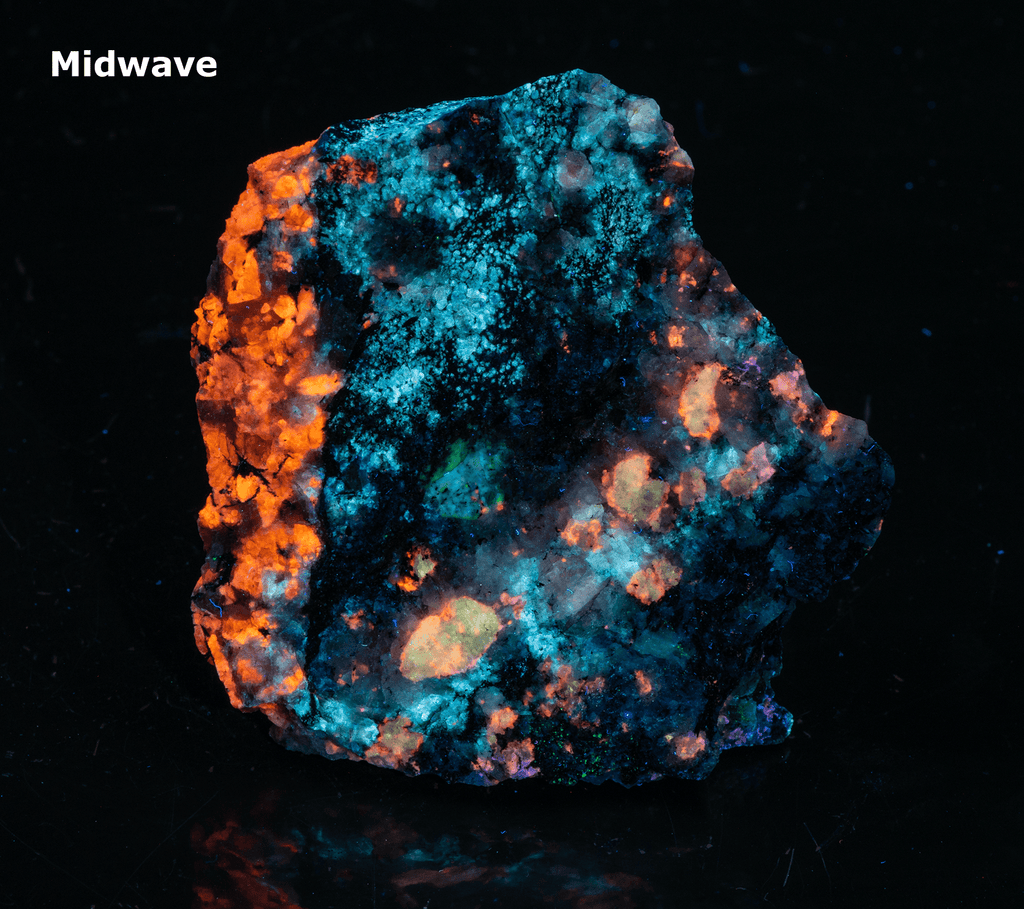 A piece of our highly sought after "Fantasy Rock". This piece features rich tugtupite that fluoresces a deep cherry red under shortwave UV.