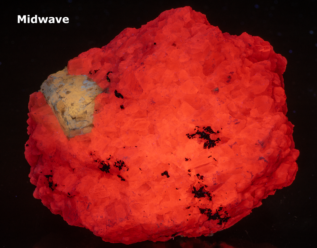 A huge specimen with a very nice, well-formed marialite (scapolite) crystal, fluorescent a bright yellow under longwave UV, on a calcite matrix