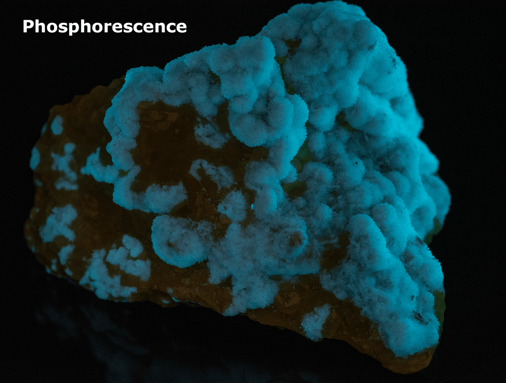 Yellow sulphur crystals sit atop an aragonite matrix