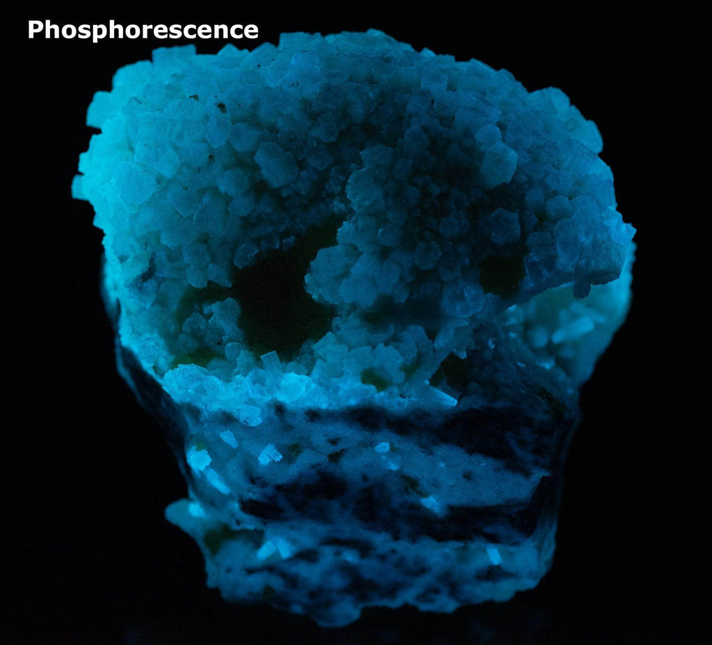 Yellow sulphur crystals sit atop an aragonite matrix