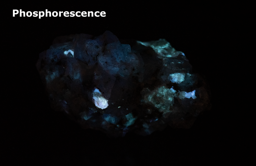 A piece of our highly sought after "Fantasy Rock". This piece features rich tugtupite that fluoresces a deep cherry red under shortwave UV.