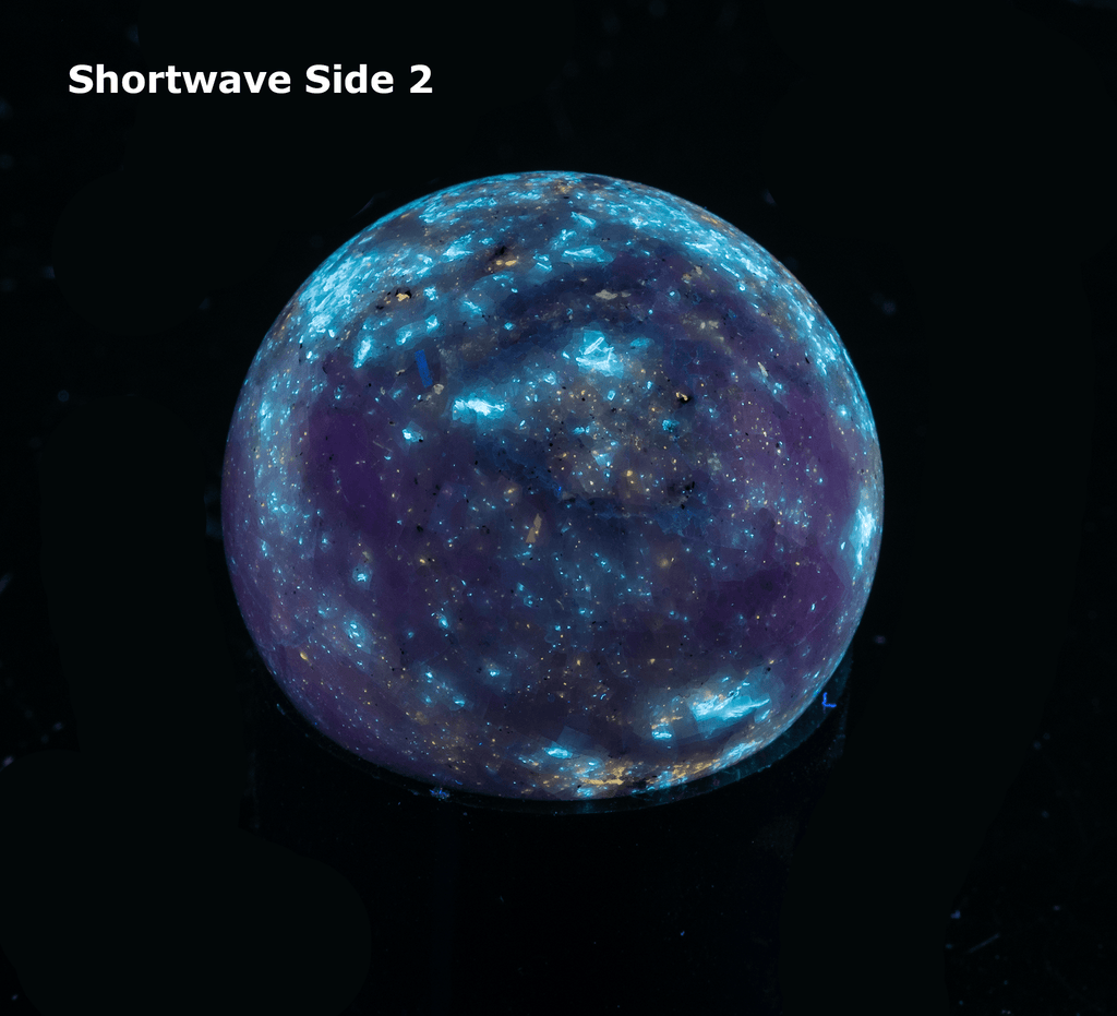 fluorescent diopside and chondrodite sphere from canada