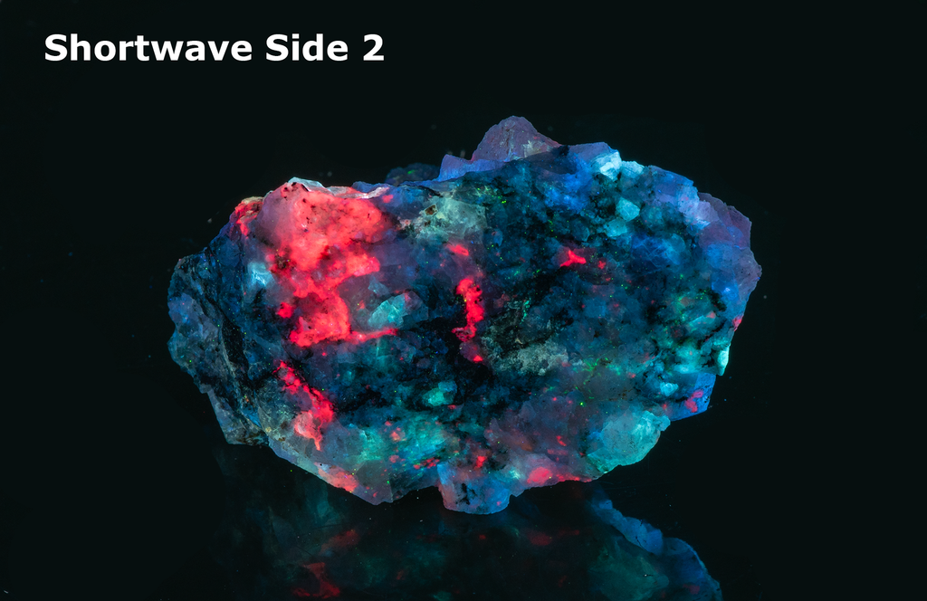 A piece of our highly sought after "Fantasy Rock". This piece features rich tugtupite that fluoresces a deep cherry red under shortwave UV.