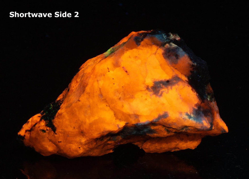 A deeply tenebrescent hackmanite sodalite specimen