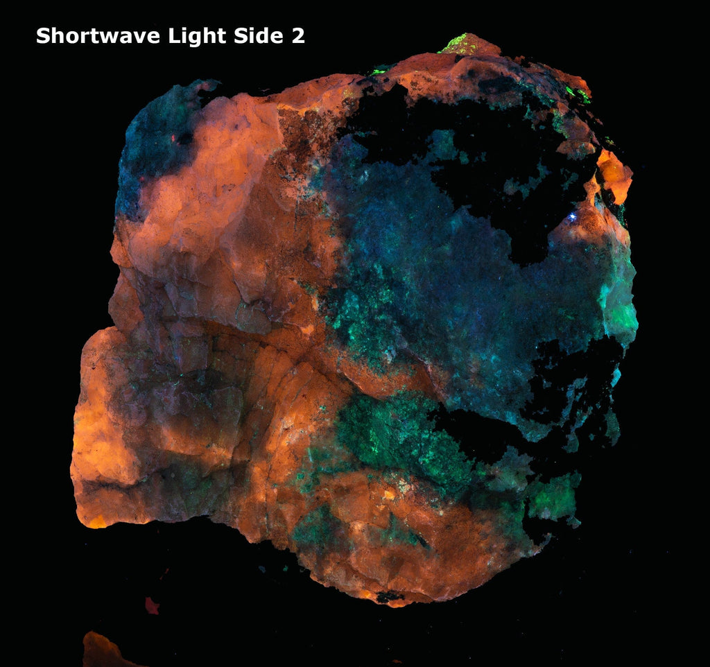 A mineral specimen of fluorescent sodaite with minor tugtupite from Greenland shown under UV light.
