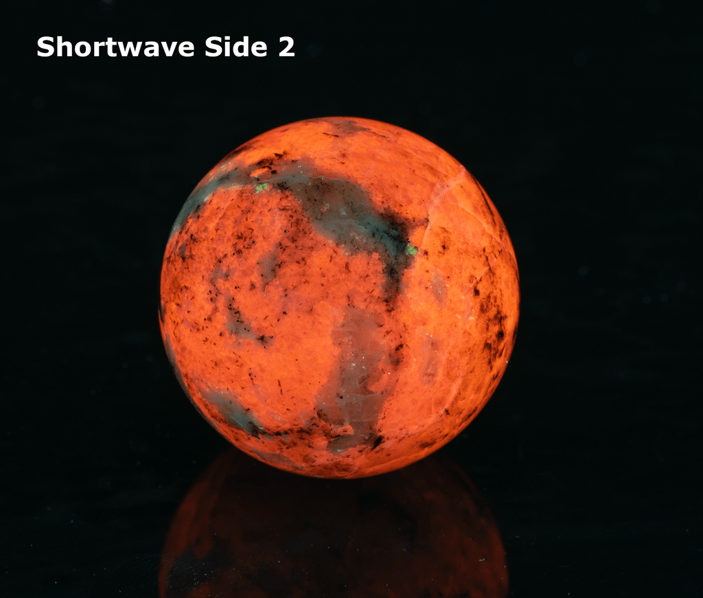 fluorescent sodalite sphere with deep tenebrescence
