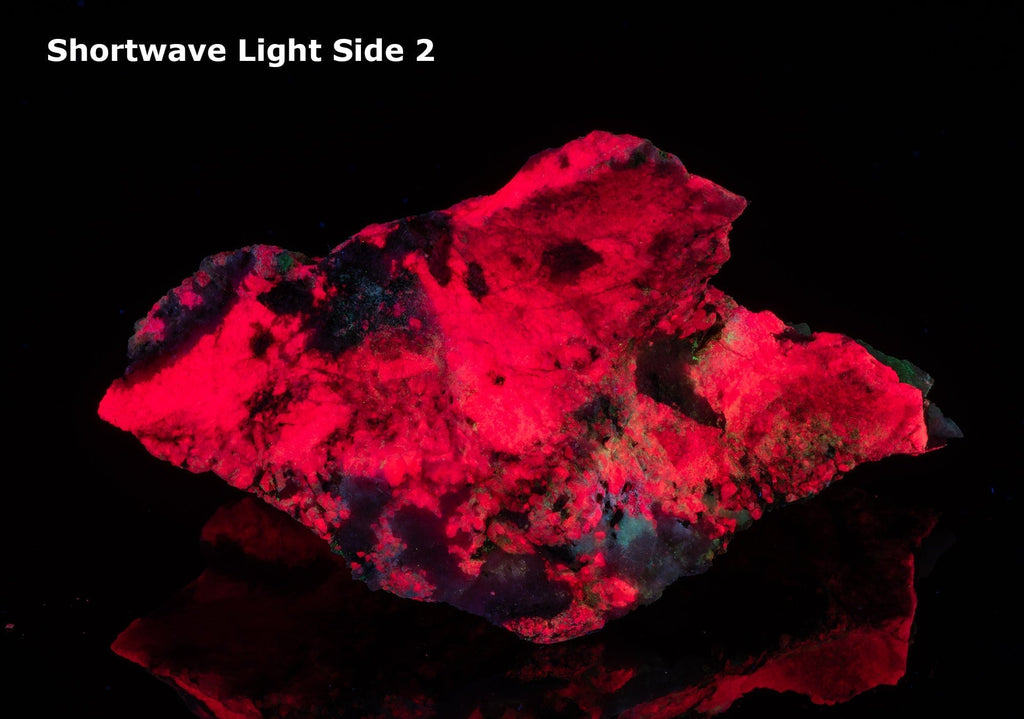 An incredible, unusual gemmy and extremely tenebrescent tugtupite specimen from Kangerlussaq.