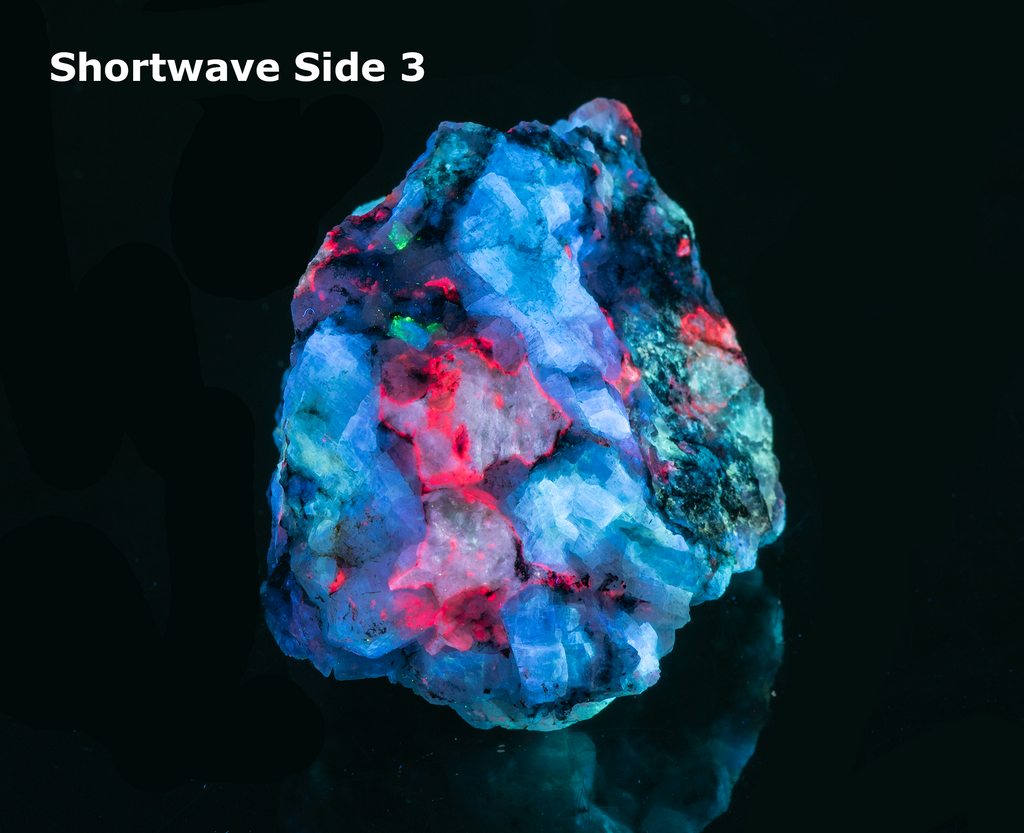 A piece of our highly sought after "Fantasy Rock". This piece features rich tugtupite that fluoresces a deep cherry red under shortwave UV.