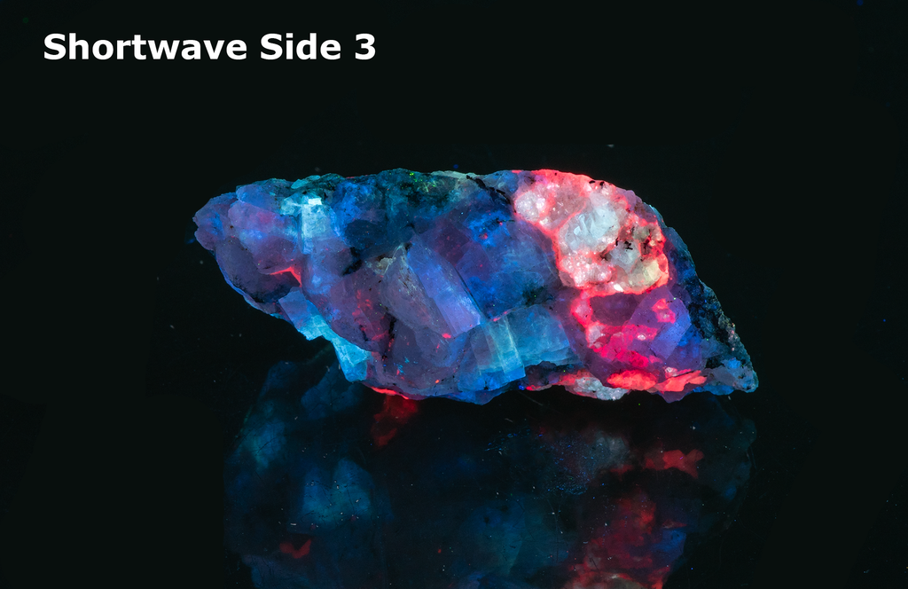 A piece of our highly sought after "Fantasy Rock". This piece features rich tugtupite that fluoresces a deep cherry red under shortwave UV.