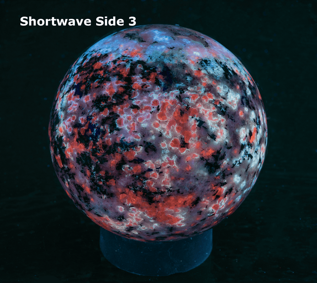 Fantasy rock sphere with sodalite, tugtupite, chkalovite, analcime from greenland. Tenebrescent.