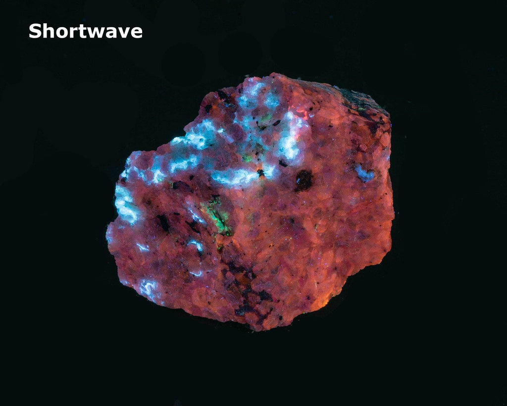 A deeply tenebrescent hackmanite sodalite specimen with minor tugtupite