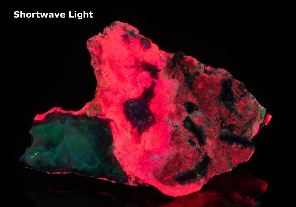 An incredible, unusual gemmy and extremely tenebrescent tugtupite specimen from Kangerlussaq.