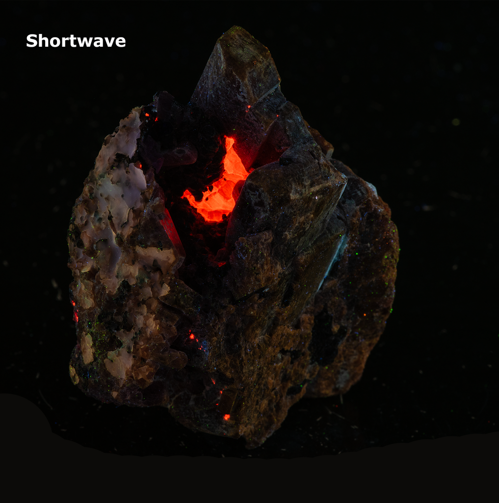 Deep Pink Rhodonite Crystals with Fluorescing Calcite from Franklin Mine