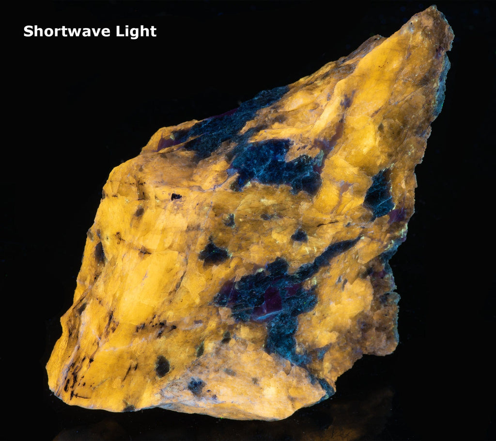 A fluorescent mineral rock of yellow wernerite